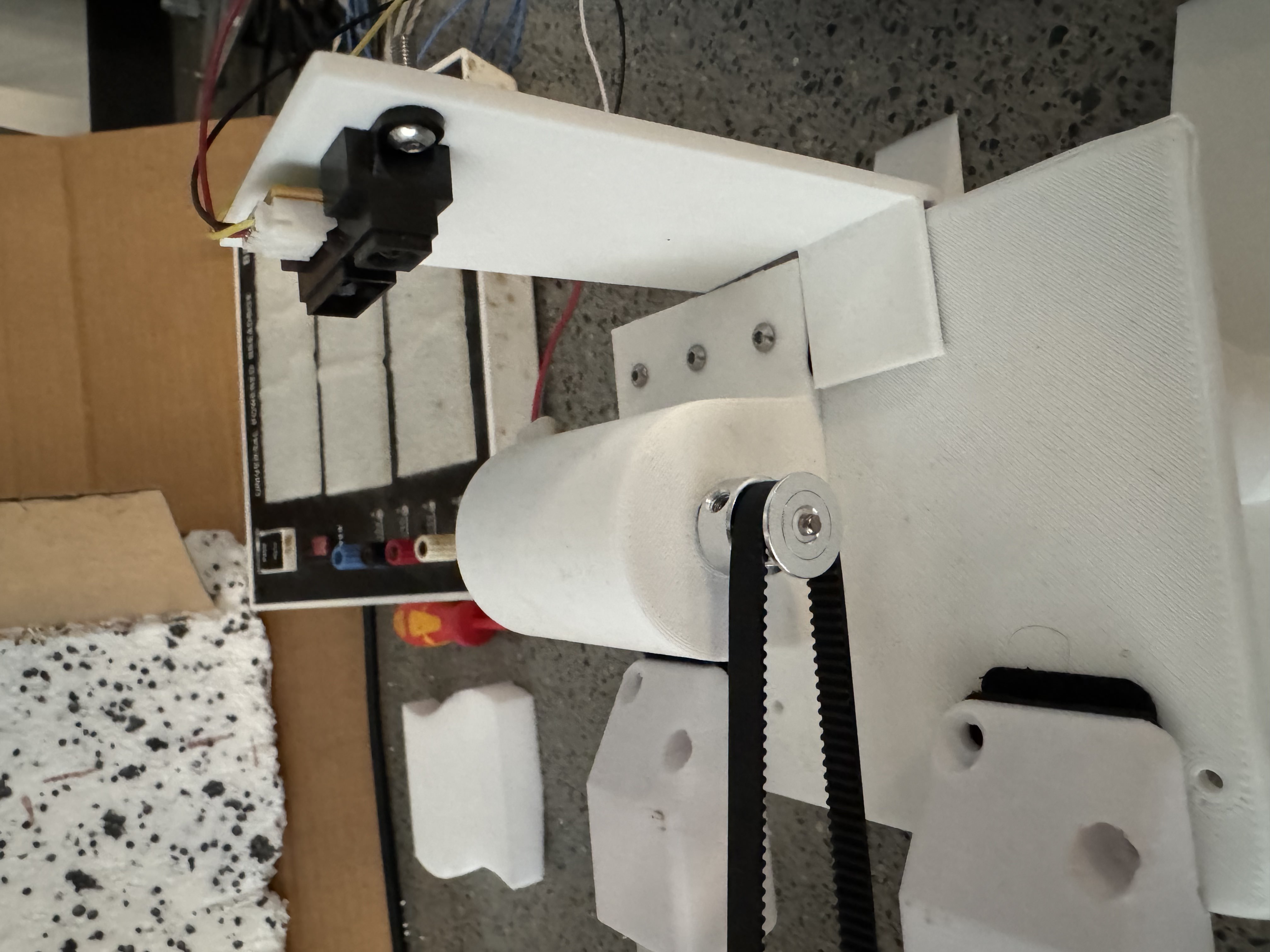 Belt drive and limit switch assembly for the dynamic sound attenuator